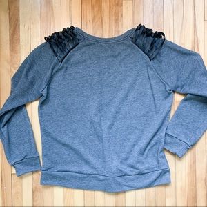 Grey sweater w/knotted black faux leather shoulder